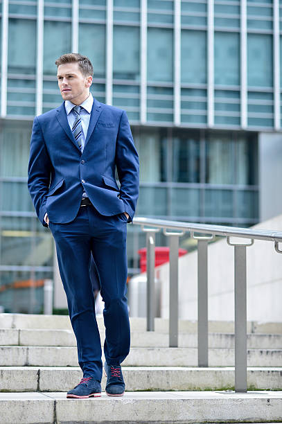 istock Corporate guy walking down the stairs 522519669