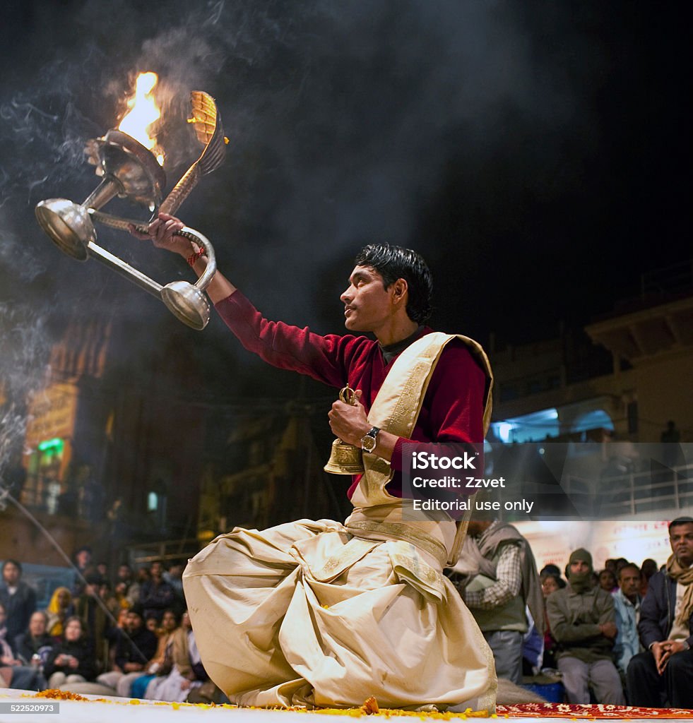 Ganga Maha Aarti Ceremony, India Varanasi, Uttar Pradesh State, India - January 14, 2010: Hindu priest conducts religious Ganga Aarti ritual (fire puja) at Dashashwamedh Ghat. Aarti - Praying Stock Photo