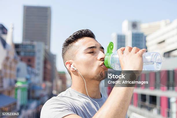 Athlete Drinking Water From His Bottle Stock Photo - Download Image Now - Africa, Athlete, Bottle