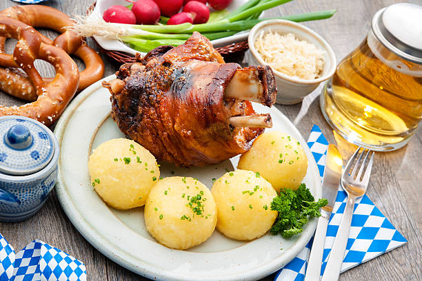 schweinshaxe - spit roasted pig roasted food стоковые фото и изображения