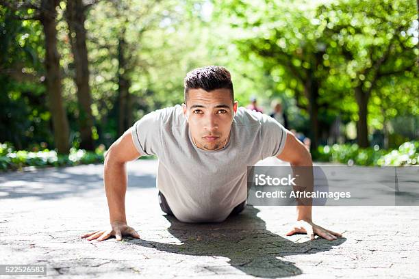 Young Man Doing A Push Up In The City Park Stock Photo - Download Image Now - Active Lifestyle, Africa, Athlete