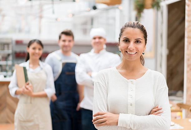 istock Business owner at a restaurant with her staff 522527534