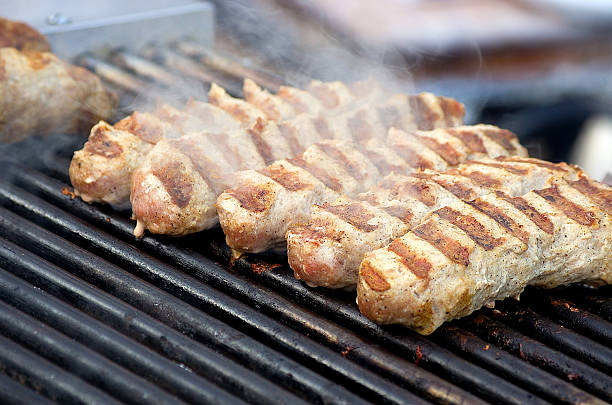 istock Appetizing delicious fried meat frankfurters sausage on a barbec 522527738