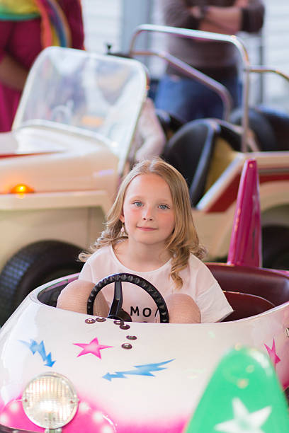 istock Child in amusement park ride 522529470
