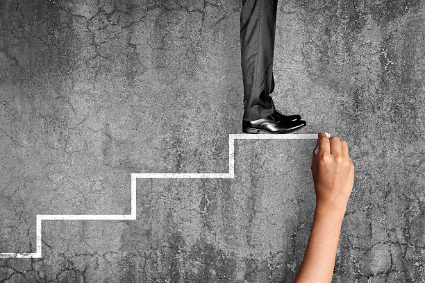 istock Businessman standing on stairs 522530704