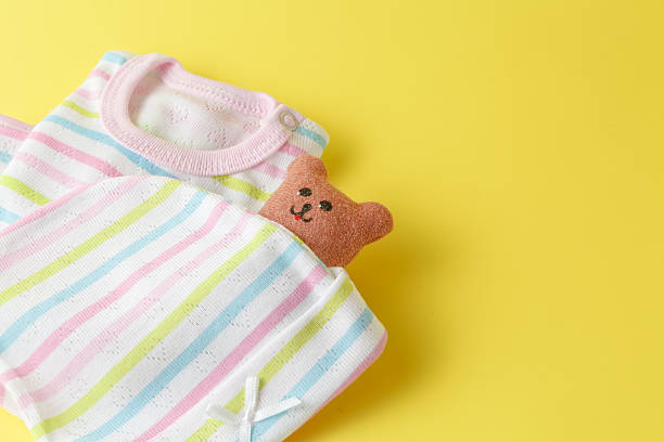 istock Baby clothing on a yellow background 522534834