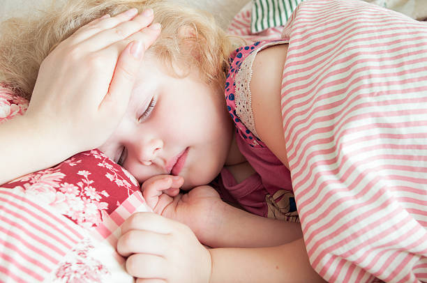 istock ill girl child caring mother 522535572