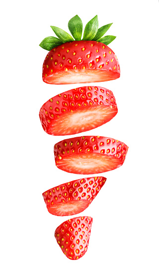 Falling sliced strawberry isolated on white Clipping Path