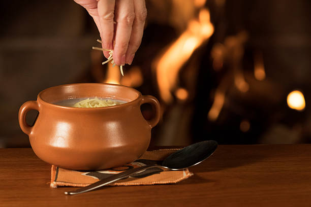 istock Serving Parmesan Cheese on a Bowl of Warm Soup 522536390