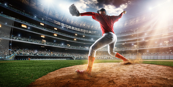 Image of a baseball batter ready to throw baseball. He is wearing unbranded generic baseball uniform. The game takes place on outdoor baseball stadium full of spectators under stormy evening sky at sunset. The stadium is made in 3D.
