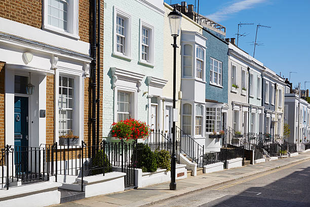Colorful English houses facades in London Colorful English houses facades in a sunny day in London, nobody kensington and chelsea photos stock pictures, royalty-free photos & images