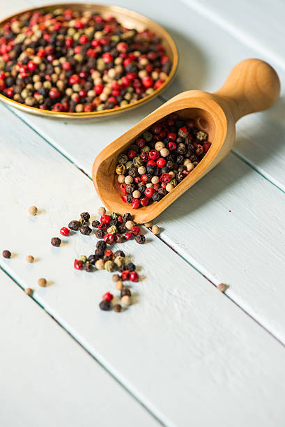 istock Wooden spoon with colorful chili seeds 522538929