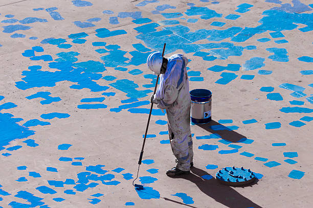 istock Young Seaman Painting His Ship 522539096