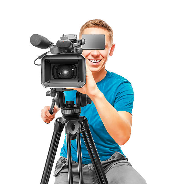 Video camera operator Video camera operator smile and working with his professional equipment isolated on white background camera operator stock pictures, royalty-free photos & images