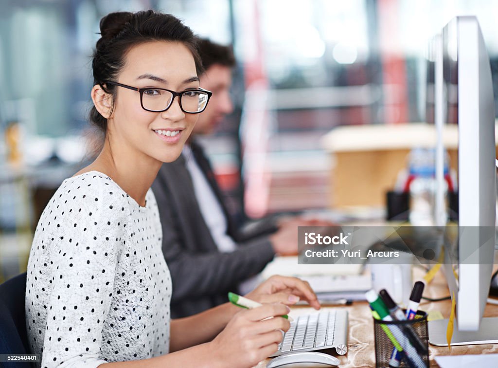 I'm all about efficiency Shot of a young office worker sitting at her workstation in an officehttp://195.154.178.81/DATA/i_collage/pi/shoots/784300.jpg 20-24 Years Stock Photo