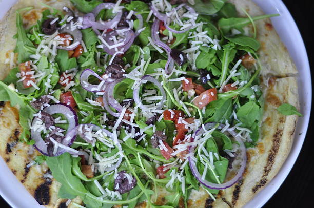 istock Gourmet Arugula Salad Pizza 522540981