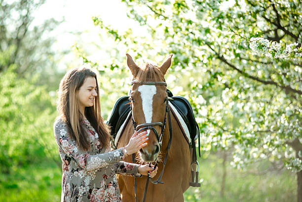 istock girl and horse 522541192