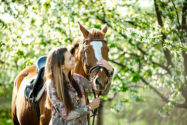 istock girl and horse 522541336