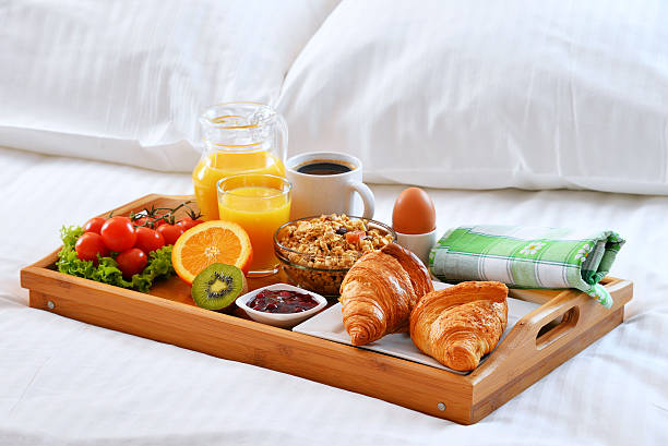 istock Breakfast tray in bed in hotel room 522541556