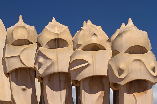 Barcelona, Spain, - April 24, 2013: Casa Mila. On the rooftop there are twenty-eight chimneys in several groupings  twisted so that the smoke came out better This famous building, designed by Antoni Gaudi, is a UNESCO World Heritage Site. 