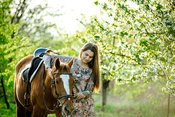 istock girl and horse 522541680