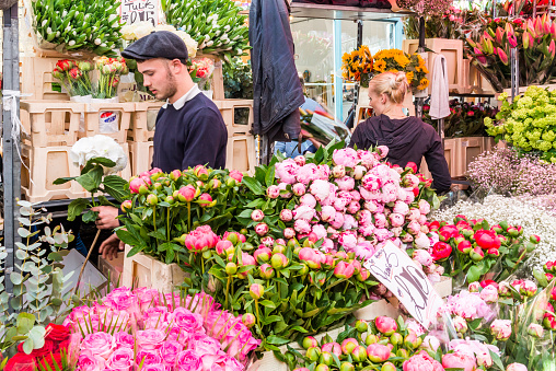 London, United Kingdom - April 17, 2016: Columbia Road Flower Sunday market. Street traders are selling their stock, people choosing flowers