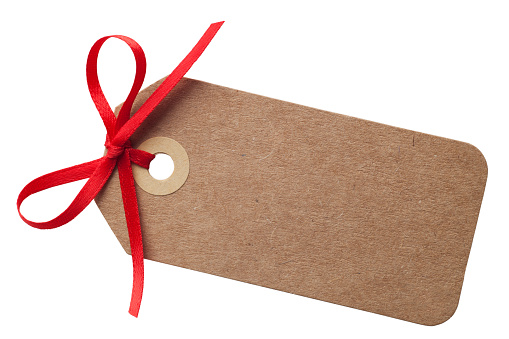 Brown paper gift tag with a red ribbon bow, isolated on white background with clipping path