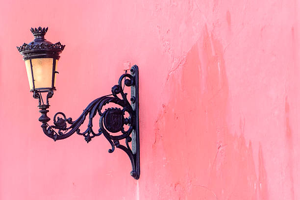 Decorative street lamp on an old colorful building.  Old San Juan, Puerto Rico