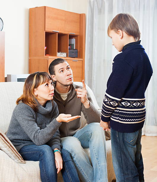 istock Serious parents berating their child 522543755