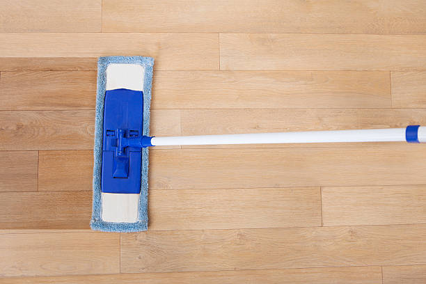 istock Hardwood Floor Being Cleaned By Mop 522544409