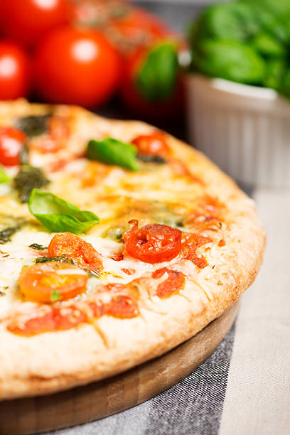 istock italian pizza on tablecloth with tomatoes half 522544669
