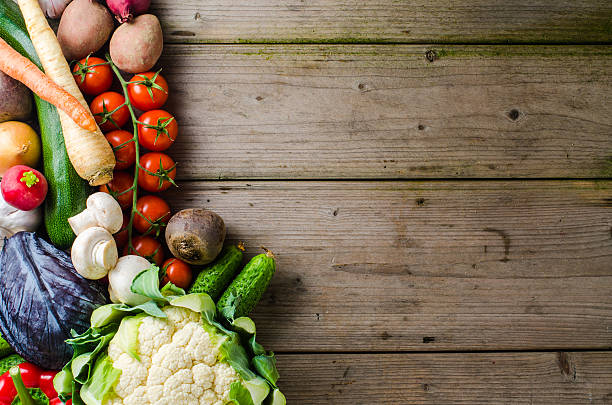 istock Overhead shot of mixed vegetables on wooden table 522545072