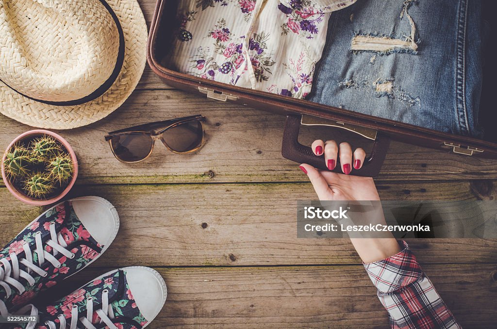 Travel preparations on wooden table Travel preparations on an old wooden table Preparation Stock Photo