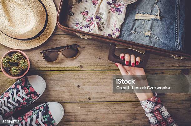 Travel Preparations On Wooden Table Stock Photo - Download Image Now - Preparation, Leaving, Vacations