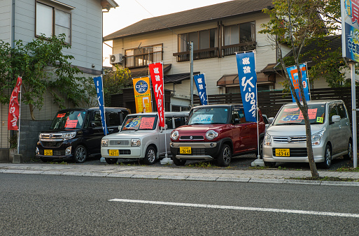Yufuin, Japan - September 28, 2014: Cars for sell on the main shopping street of Yufuin in Oita, Japan. Yufuin was a town located in Oita District, Oita Prefecture, Japan. Yufuin is now a district within the city of Yufu.
