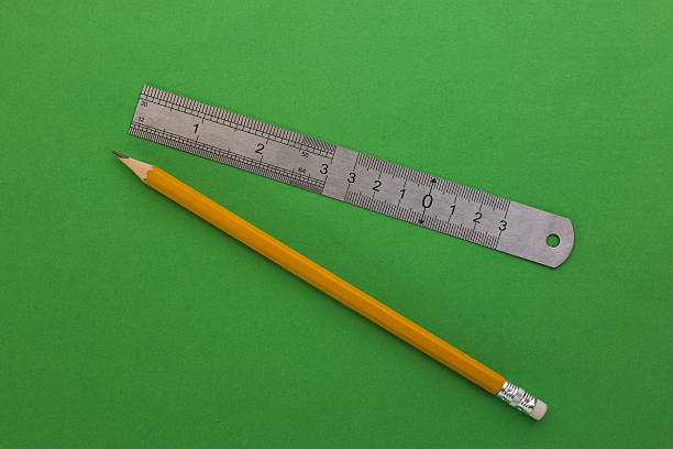 istock pencil and ruler on a green background 522546682