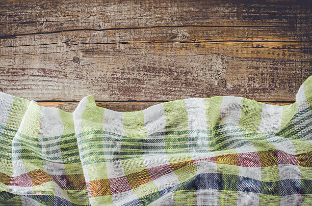 istock Overhead shot of checkered tablecloth on wooden table 522547590