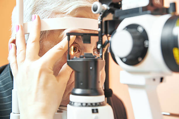 male patient under eye sight examination at ophthalmology clinic Optometry concept. Male patient under optometrist optician examinination of eyesight in eye ophthalmological clinic  dilation stock pictures, royalty-free photos & images