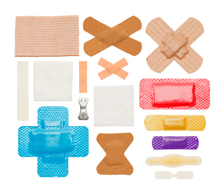 Various Bandages, Tape and Gauze Isolated on a White Background.