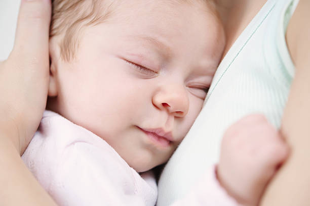istock neweborm baby girl sleeping 522551066