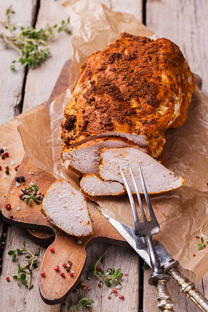 Chicken pastrami with thyme Chicken pastrami with thyme.selective focus turkey breast stock pictures, royalty-free photos & images