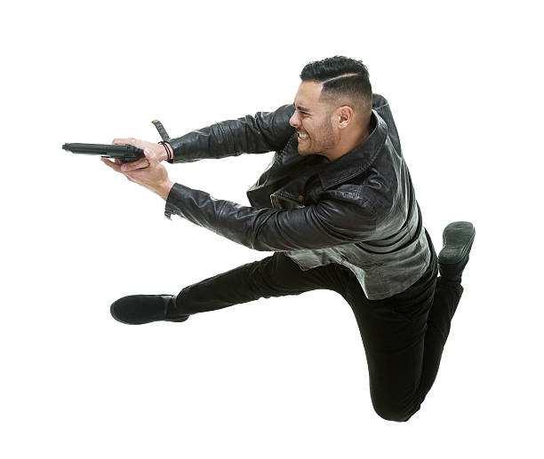 istock Casual man in action with gun 522552714