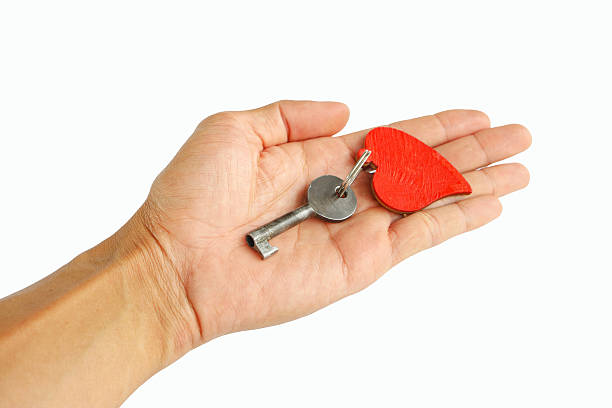 istock Hand with heart  Key to the heart 522552946