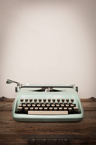 istock Vintage Manual Typewriter on Wood Trunk, Light Teal 522553190