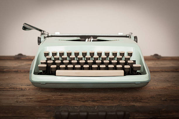 istock Vintage Manual Typewriter on Wood Trunk, Light Teal 522553726