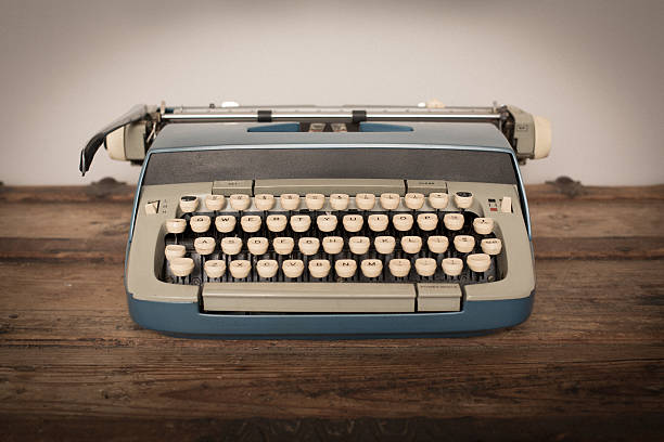 istock Vintage Manual Typewriter on Wood Trunk, Blue 522553900