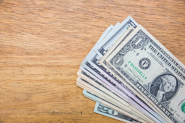 istock US dollars cash pile. 522554838
