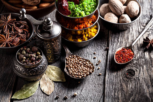 istock Spices and nuts at wooden table 522556722