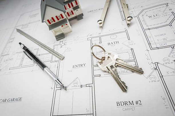 istock Home, Pencil, Compass, Ruler and Keys Resting On House Plans 522558238