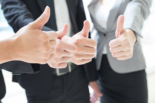 istock business team show thumb up 522558264